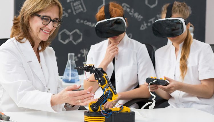 professor-and-two-science-students-wearing-vr-gogg-P6CNPLH-compressor